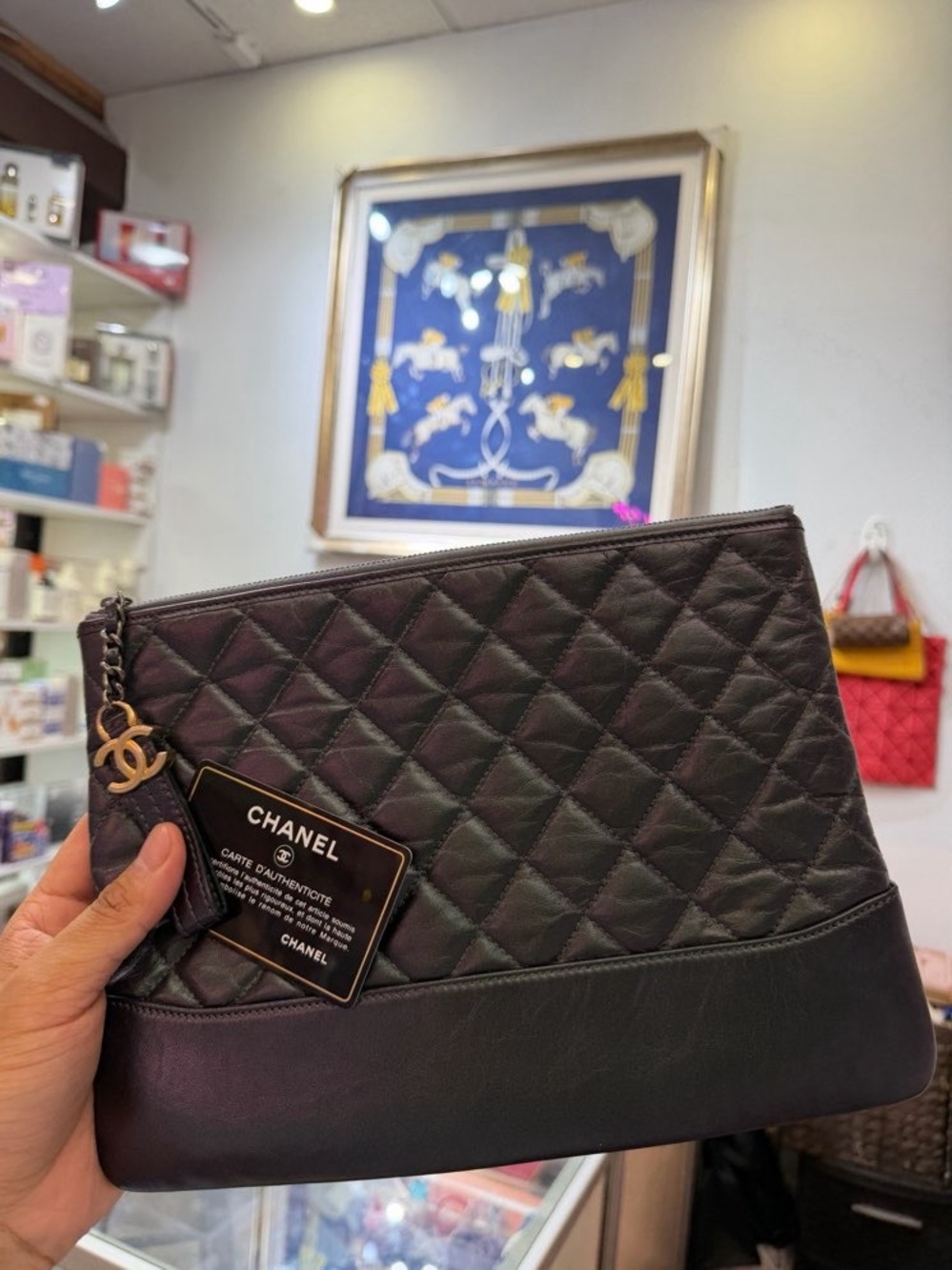 CHANEL Black Quilted Leather Wristlet Clutch with CC Charm